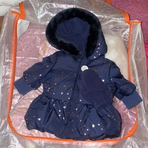 Brand new blue puffy coat with pink heart design.